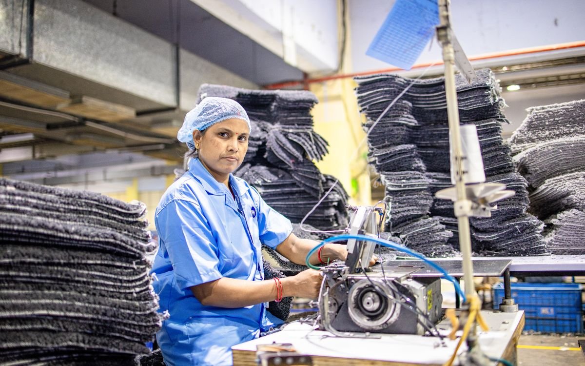 Indian woman working at a sewing machine